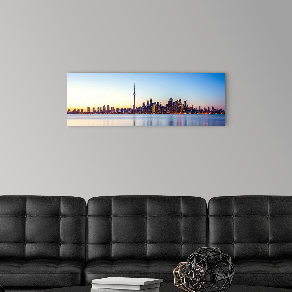 A modern room featuring Panoramic photo of Toronto city skyline at sunset, Ontario, Canada.