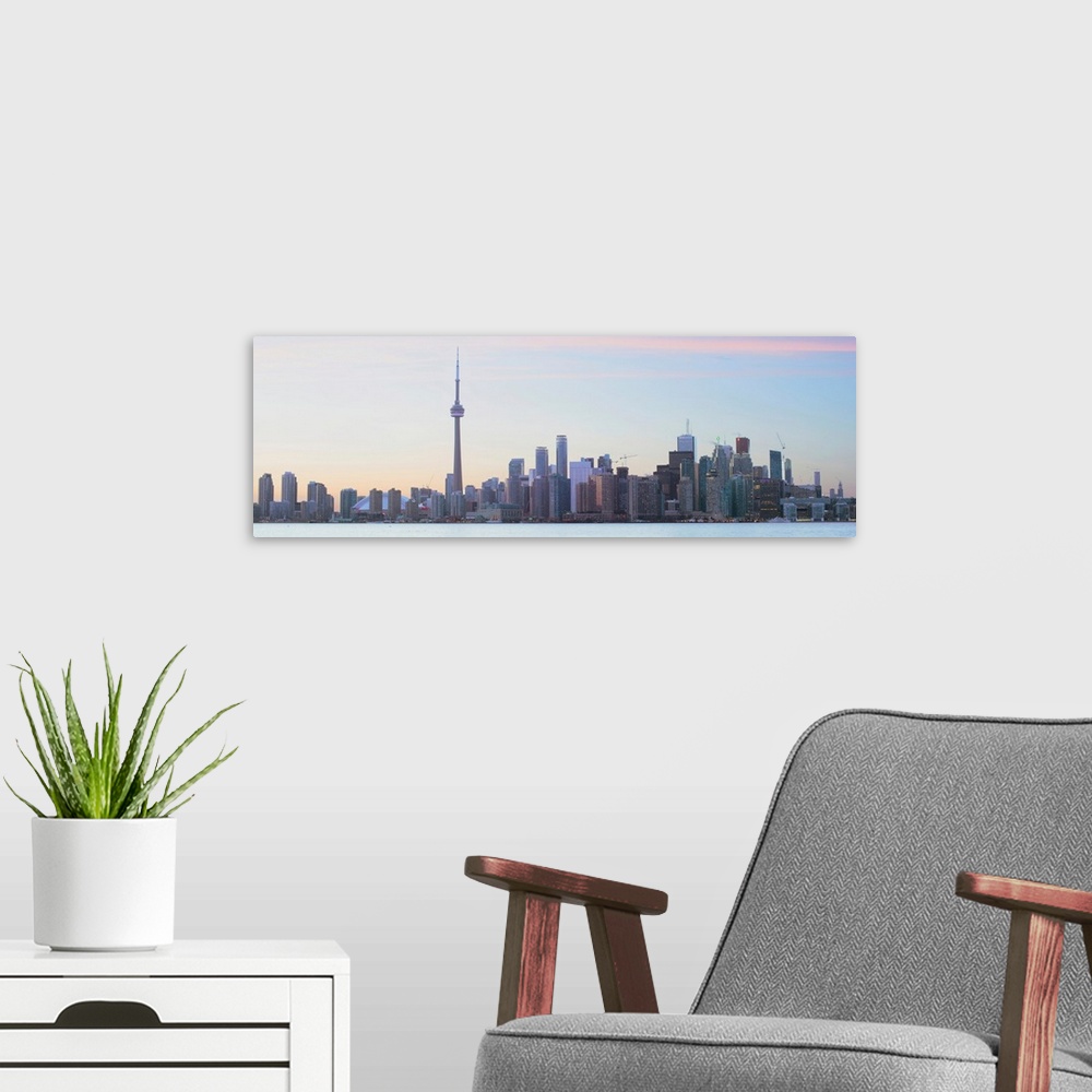 A modern room featuring Panoramic photo of Toronto city skyline under a blue sky, Ontario, Canada.