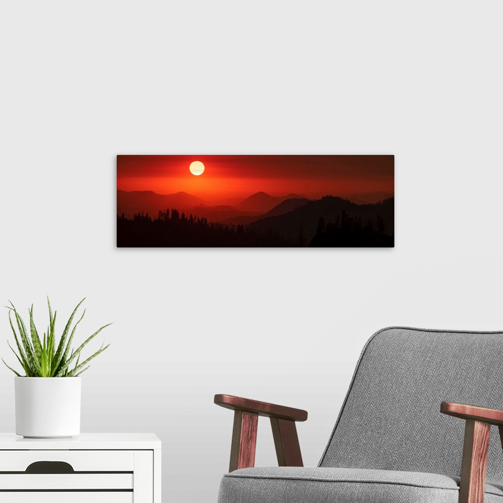 A modern room featuring Panoramic view of a darkened red sky in Sequoia National Park, California.