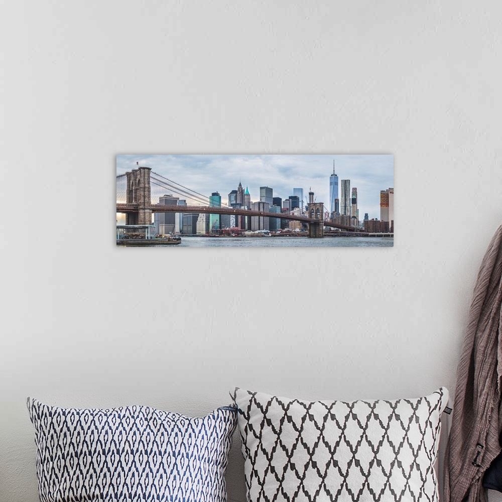A bohemian room featuring Panoramic view of New York city skyline with the Brooklyn Bridge.