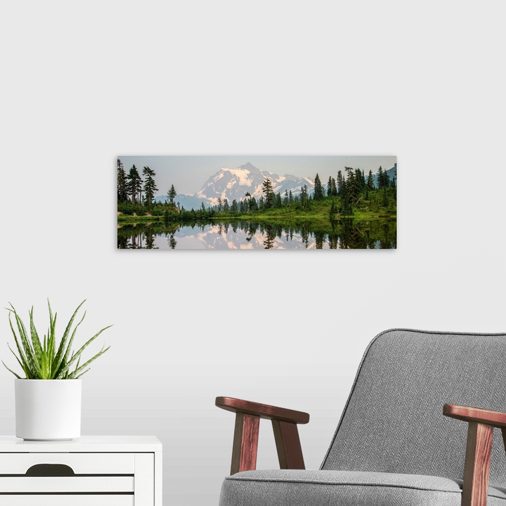 A modern room featuring Mount Shuksan is reflected in Picture Lake near Mount Shuksan, Washington.