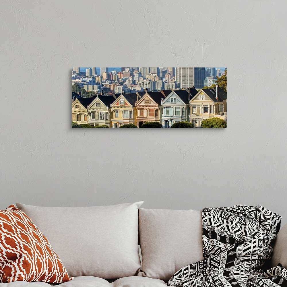 A bohemian room featuring Panoramic photograph of the Painted Ladies in downtown San Francisco with tall buildings in the b...