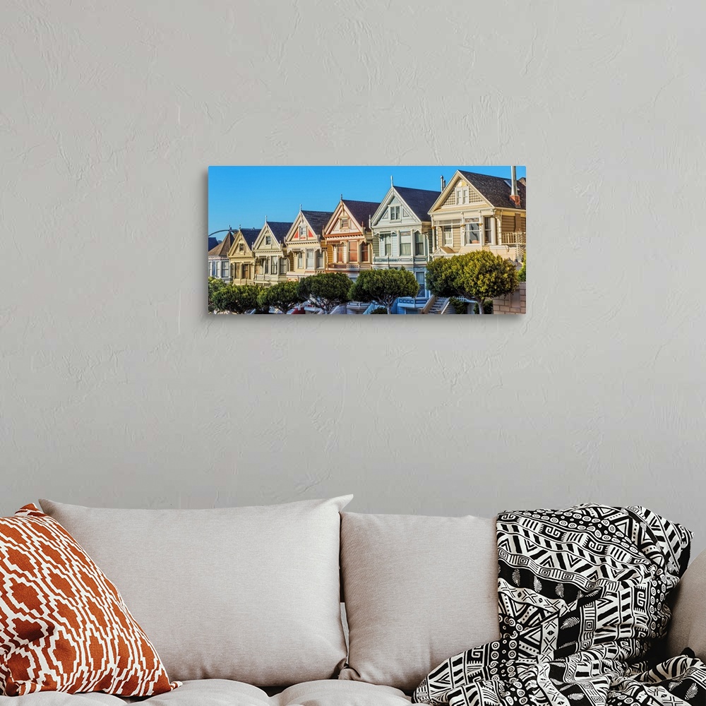 A bohemian room featuring Panoramic photograph of the Painted Ladies in downtown San Francisco.