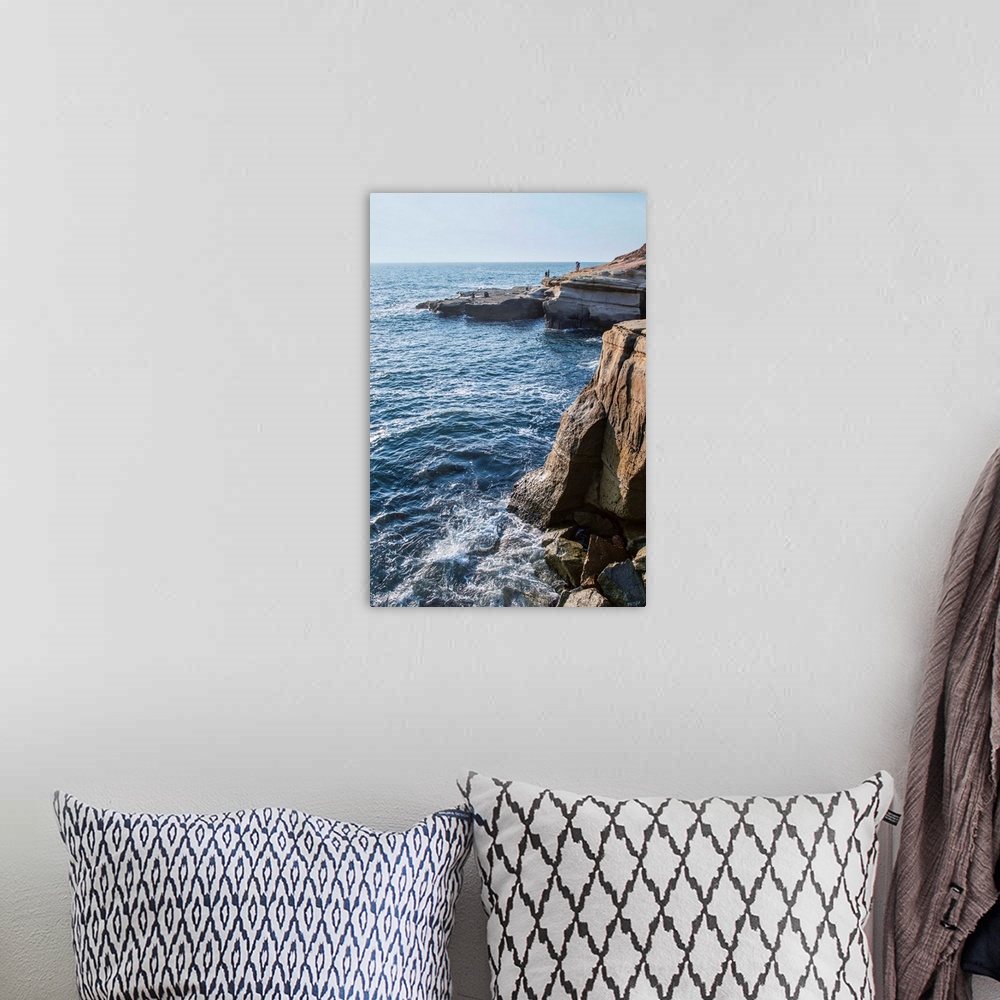 A bohemian room featuring The Sunset Cliffs in San Diego are known for their picturesque landscape.