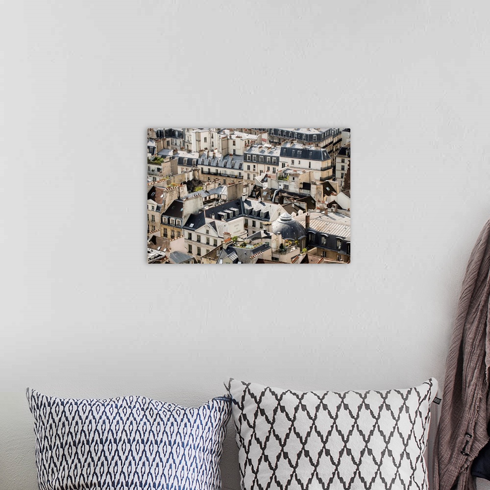 A bohemian room featuring Aerial photograph of roof tops in Paris, France