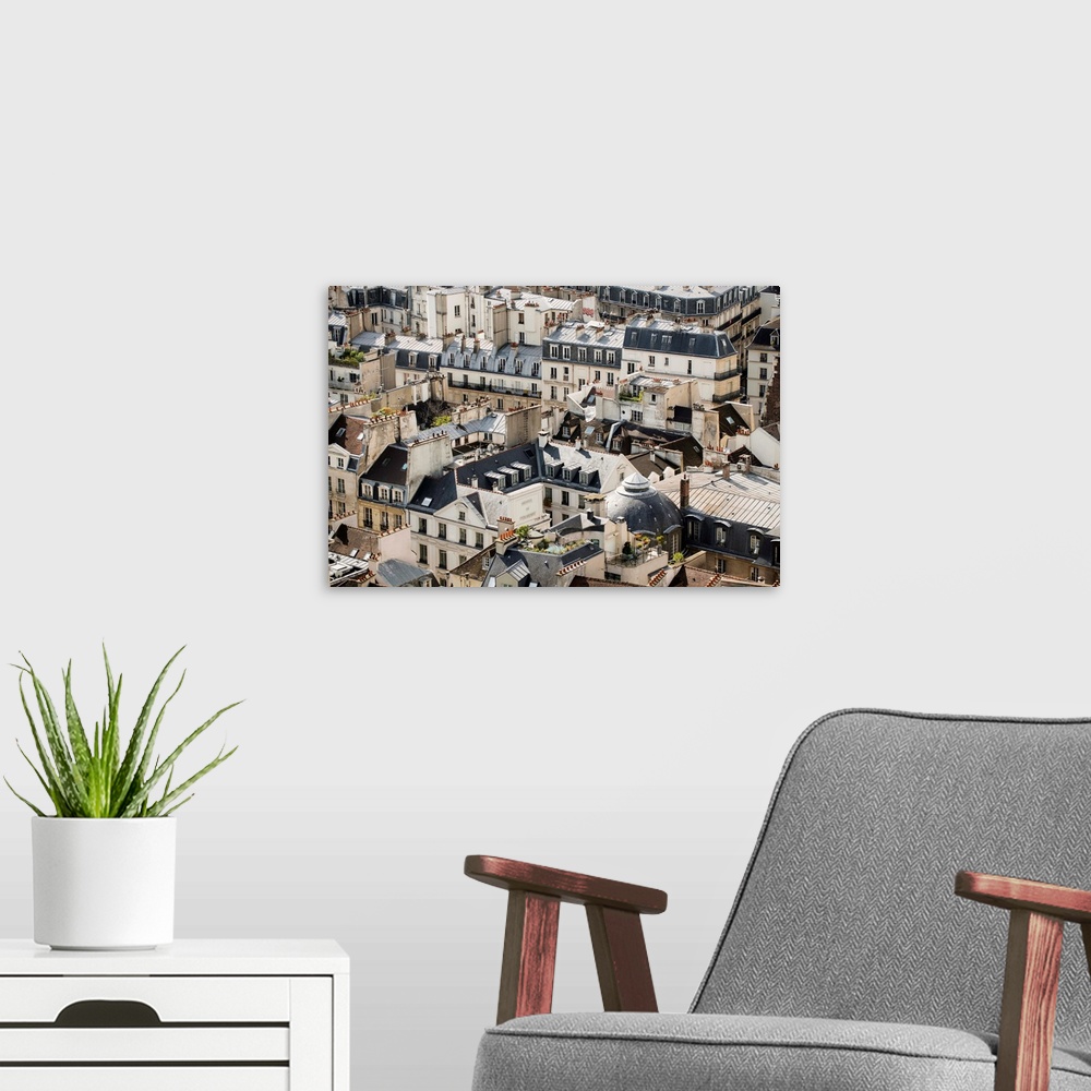 A modern room featuring Aerial photograph of roof tops in Paris, France