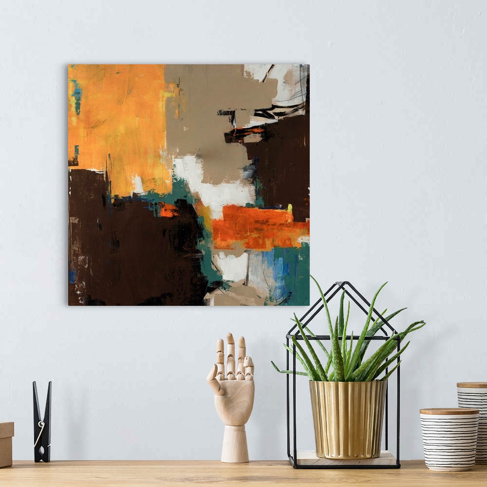 A bohemian room featuring Abstractly painted image on canvas with different patches of color layered on top of each other.