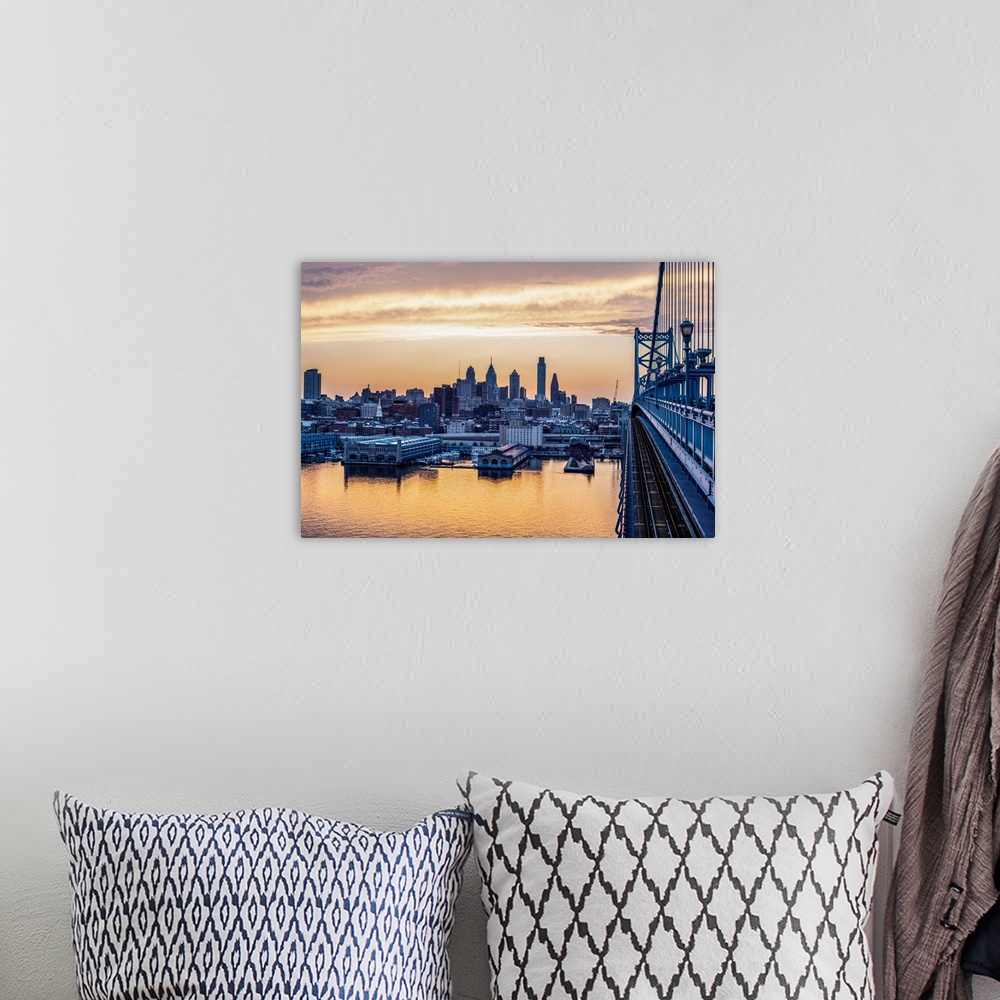 A bohemian room featuring View of Philadelphia's city skyline against a dewy melon colored sky.