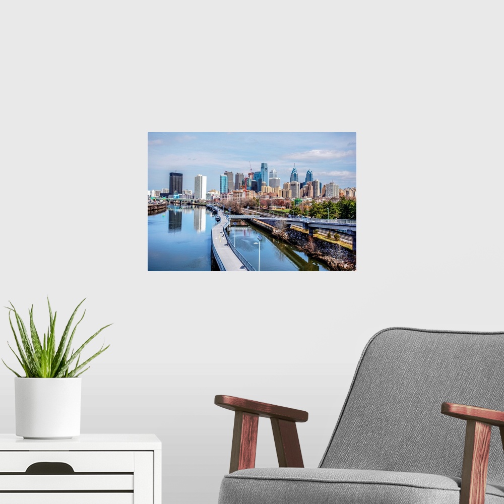A modern room featuring View of skyscrapers in Philadelphia, Pennsylvania, seen from the waterway.