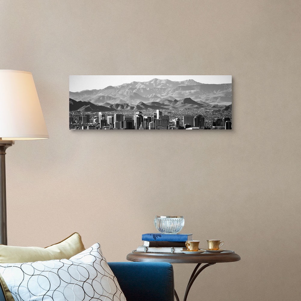 A traditional room featuring Panoramic photograph of the Phoenix, Arizona skyline with hazy desert mountains in the background.
