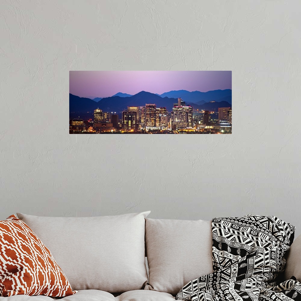 A bohemian room featuring Panoramic photograph of a colorful sunset over the Phoenix, Arizona skyline with silhouetted moun...