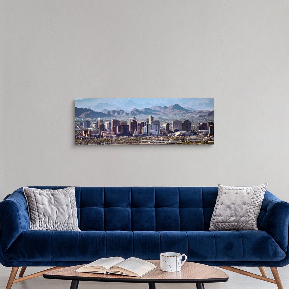 A modern room featuring Panoramic photograph of the Phoenix, Arizona skyline with hazy desert mountains in the background.