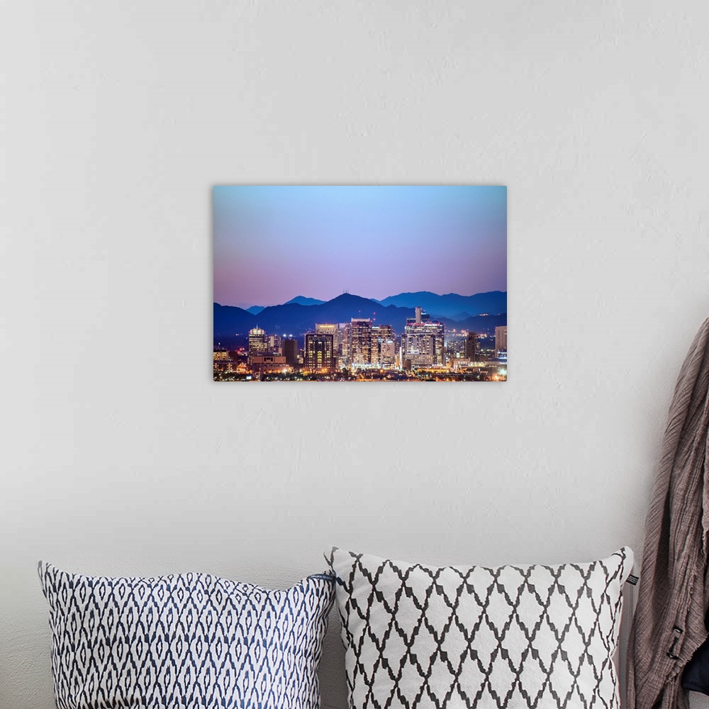 A bohemian room featuring Photograph of a colorful sunset over the Phoenix, Arizona skyline with silhouetted mountains in t...