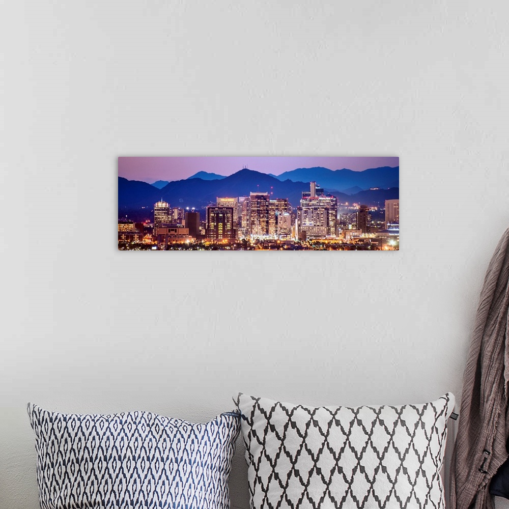 A bohemian room featuring Panoramic photograph of a colorful sunset over the Phoenix, Arizona skyline with silhouetted moun...