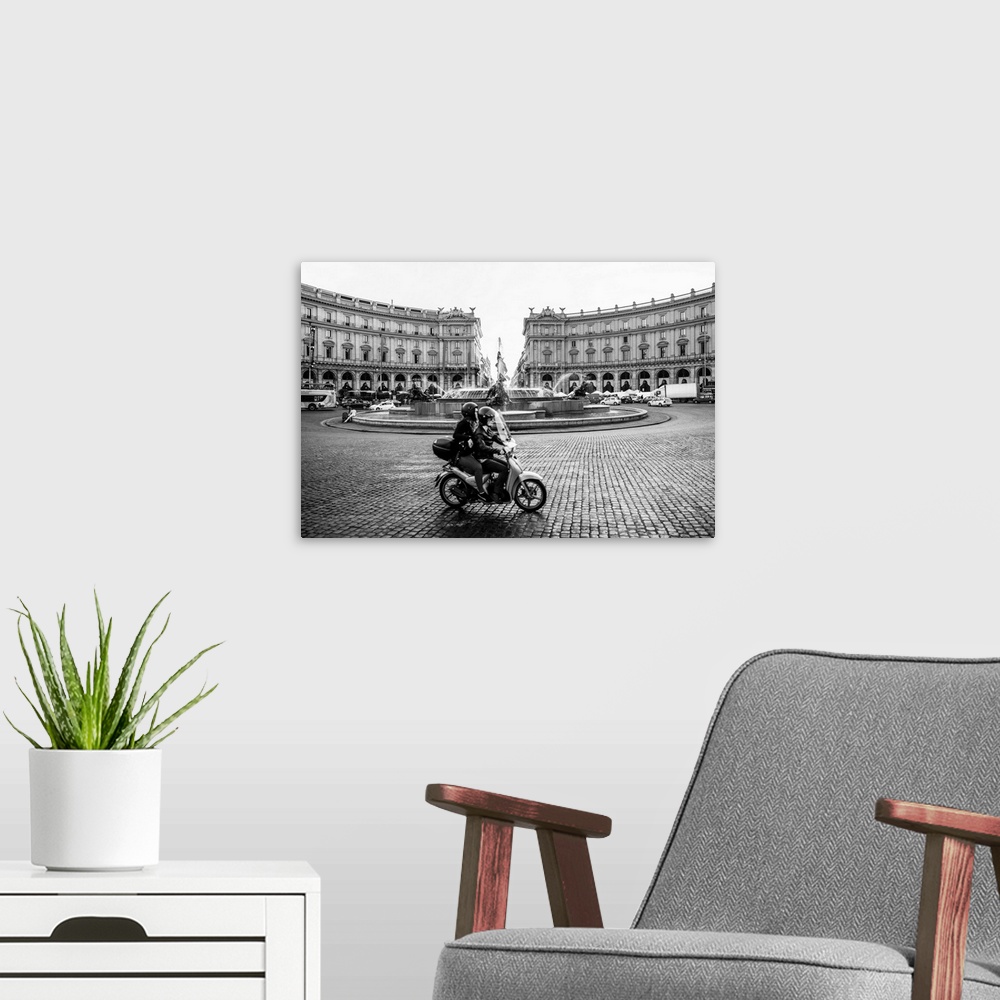 A modern room featuring Photograph of the Piazza della Repubblica with the Fountain Of The Naiads and a couple on a motor...