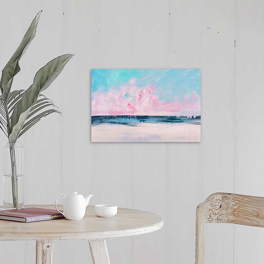 A farmhouse room featuring Semi-abstract contemporary artwork of a seascape with bright pink clouds on the horizon.