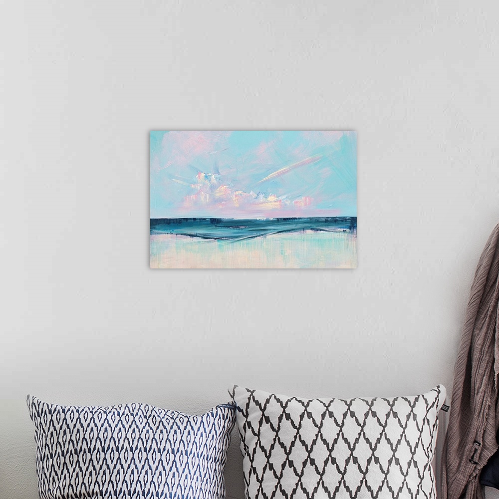 A bohemian room featuring Semi-abstract contemporary artwork of a seascape with bright pink clouds on the horizon.