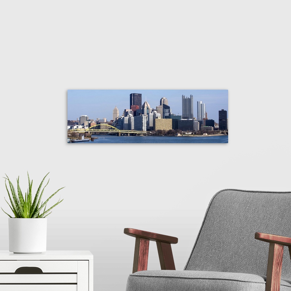 A modern room featuring Skyline of Pittsburgh, Pennsylvania, with the Fort Pitt Bridge leading into the city.