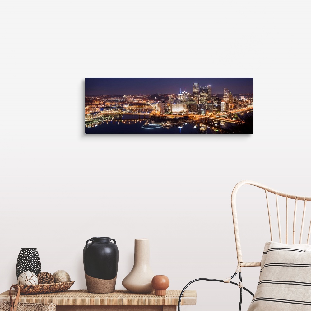 A farmhouse room featuring Panoramic photo of the city of Pittsburgh illuminated at night, with Point State Park in the fore...