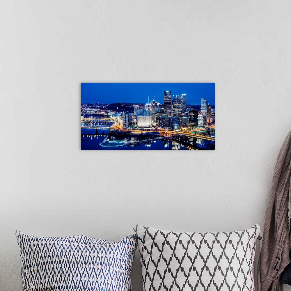 A bohemian room featuring Photo of downtown Pittsburgh at night with Point State park.