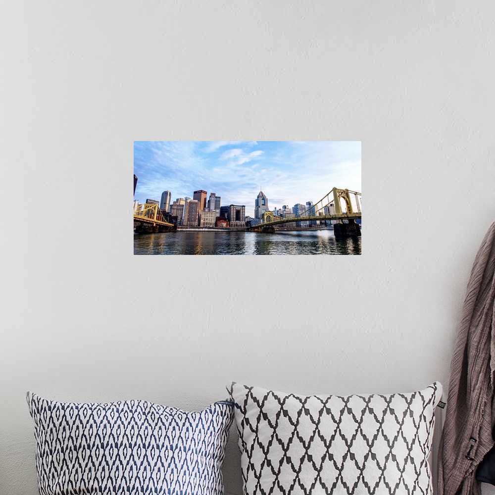 A bohemian room featuring Photo of downtown Pittsburgh with Roberto Clemente Bridge over the Allegheny River.