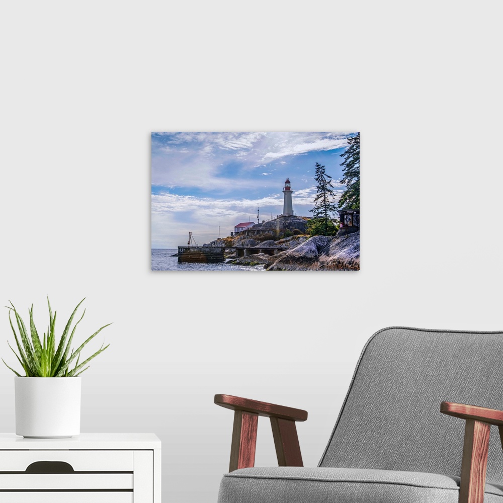 A modern room featuring View of Point Atkinson Lighthouse and blue skies in Vancouver, British Columbia, Canada.