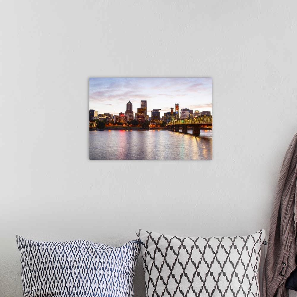A bohemian room featuring Photograph of the Portland, Oregon skyline lit up at sunset with yellow lights and a small cresce...