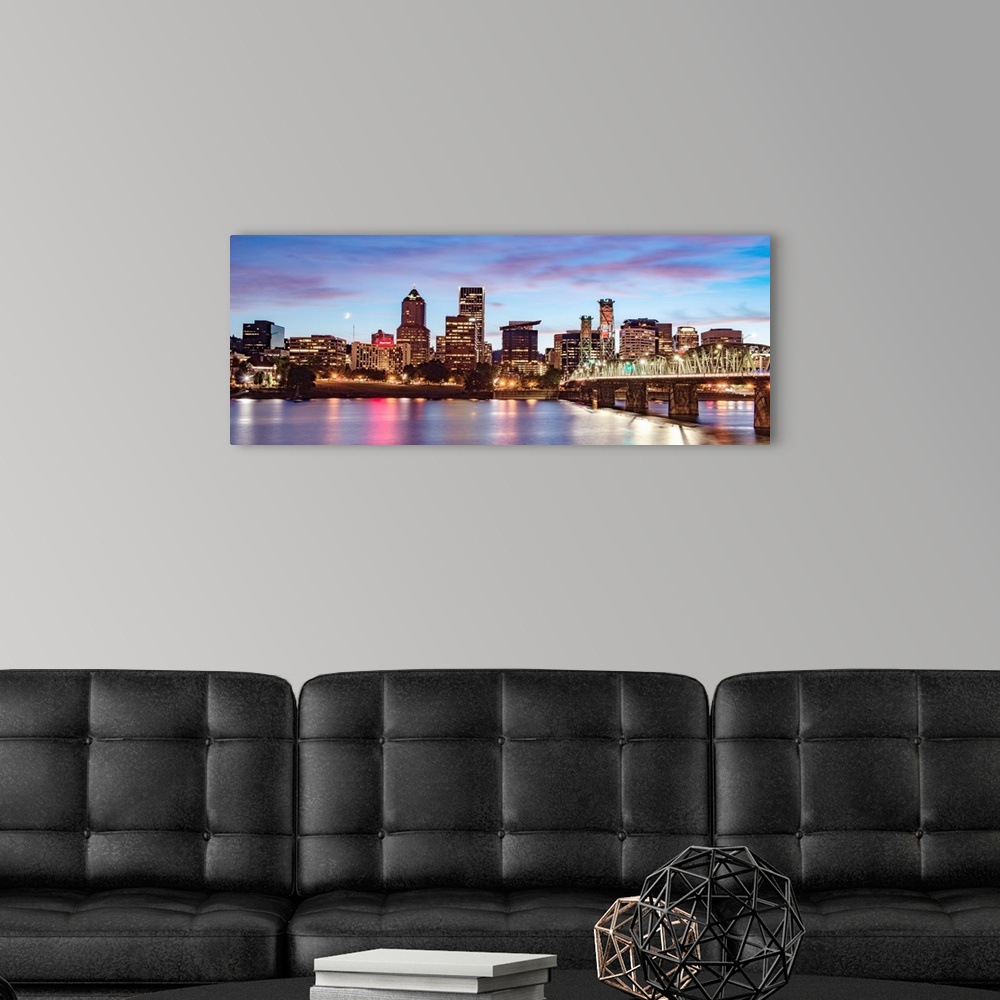 A modern room featuring Panoramic photograph of the Portland, Oregon skyline with a purple and pink sunset and a crescent...