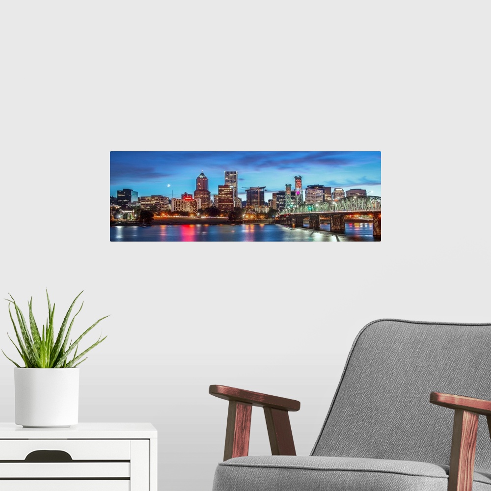 A modern room featuring Panoramic photograph of a saturated Portland, Oregon skyline at sunset reflecting onto the Willam...