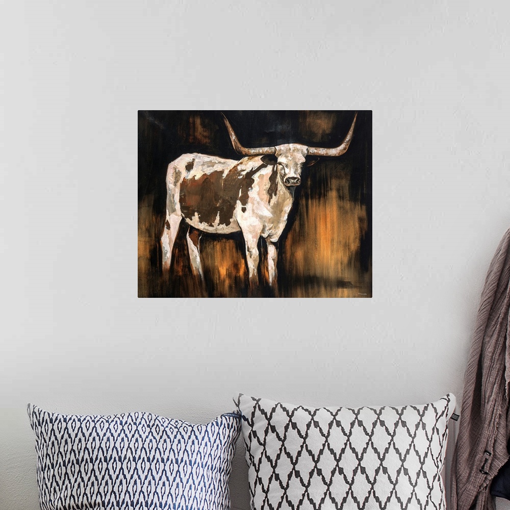 A bohemian room featuring Earth-toned portrait of a Texas Longhorn.