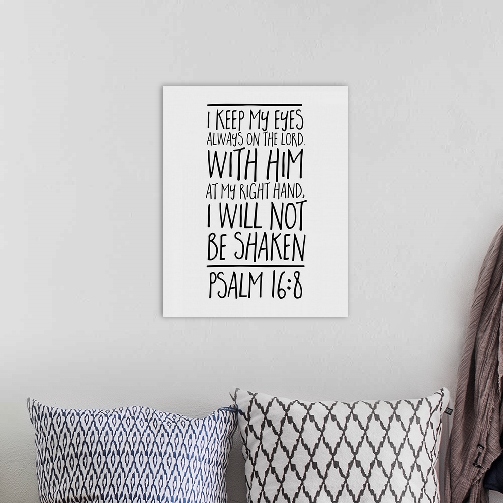 A bohemian room featuring Handlettered Bible verse reading She laughs without fear of the future.