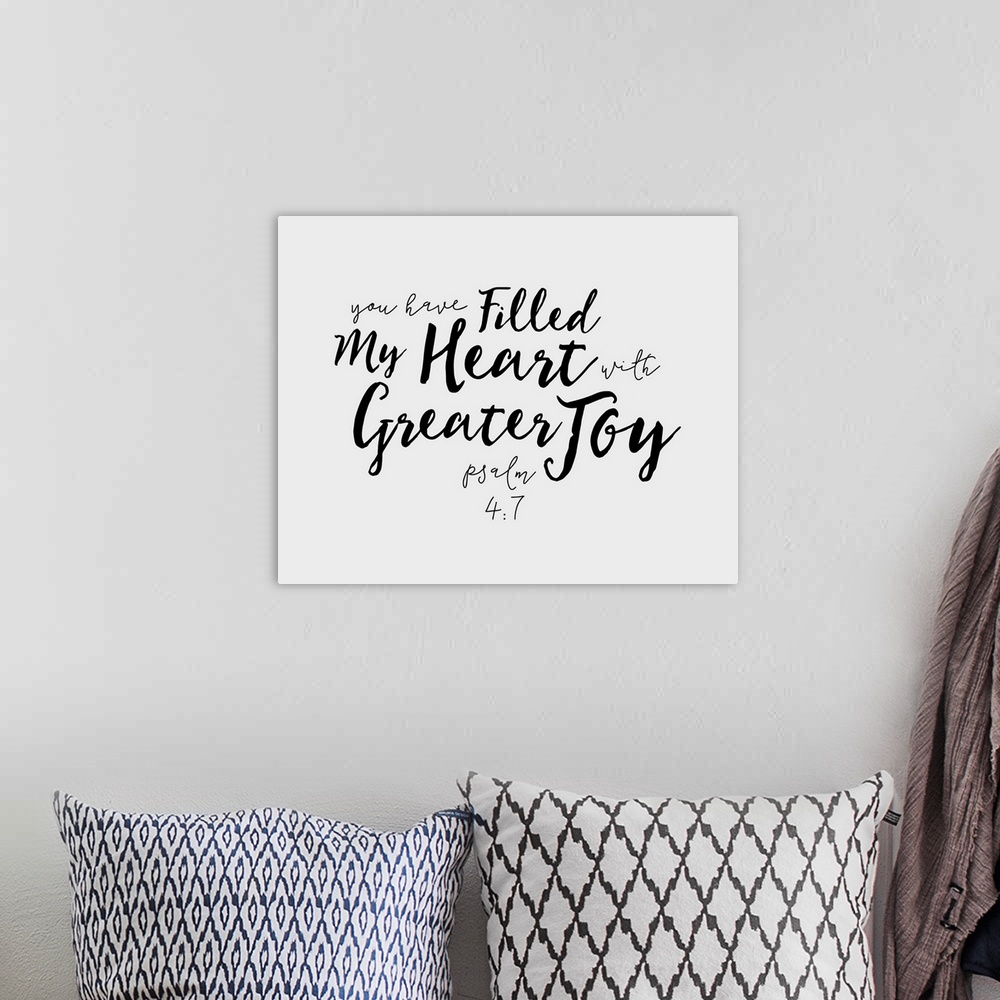 A bohemian room featuring Handlettered Bible verse reading The Lord is my light and my salvation.