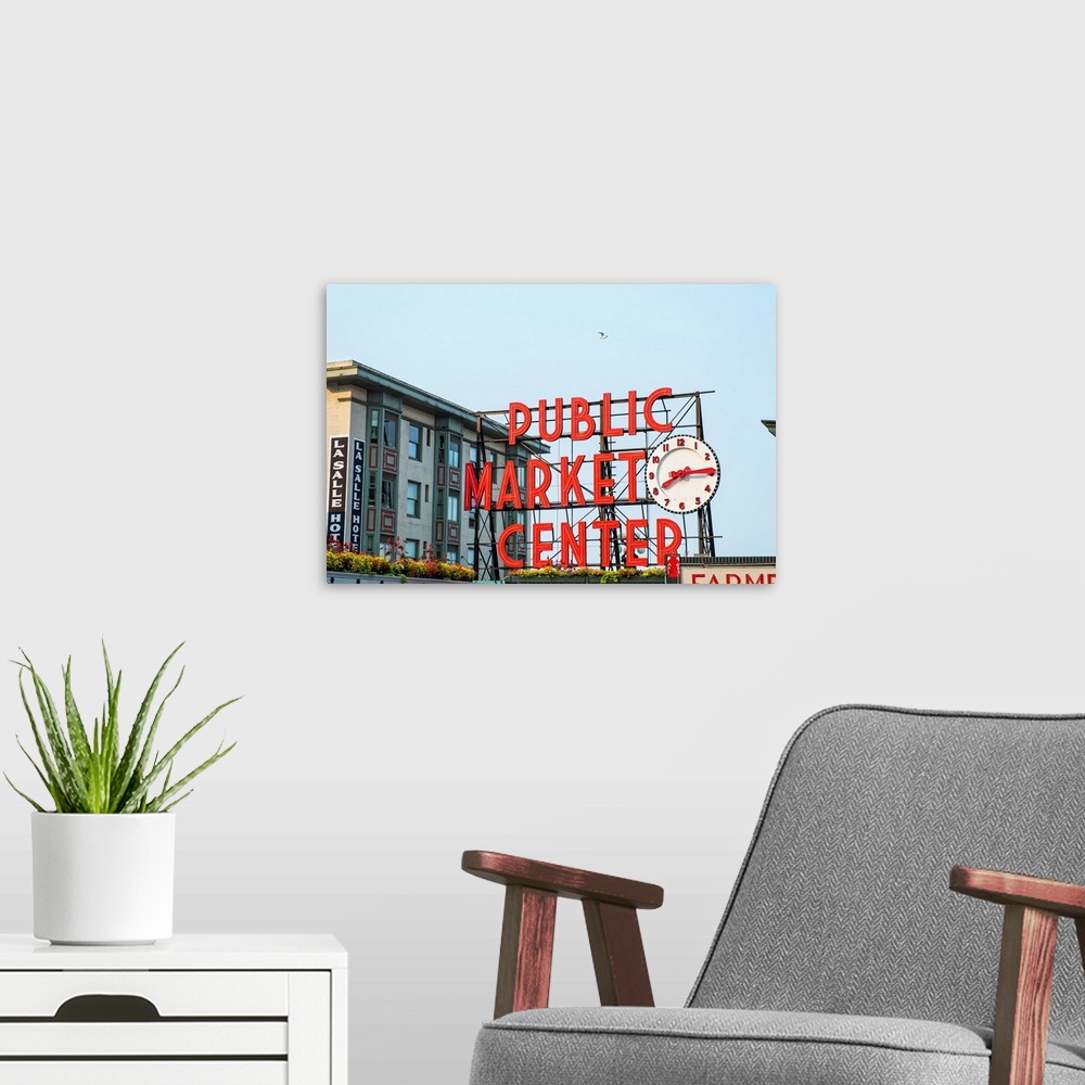 A modern room featuring Photograph of the red Public Market Center sign at the farmers market in downtown Seattle.