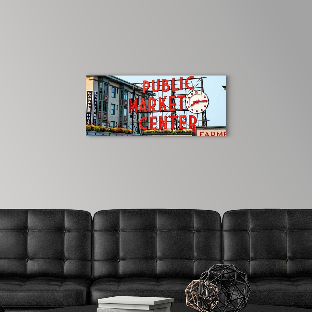 A modern room featuring Panoramic photograph of the red Public Market Center sign at the farmers market in downtown Seattle.
