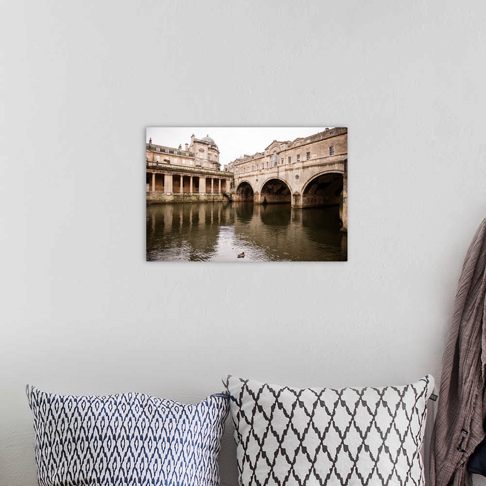 A bohemian room featuring Photograph of three arched tunnels connected to the Pulteney Bridge in Bath, England, with a duck...