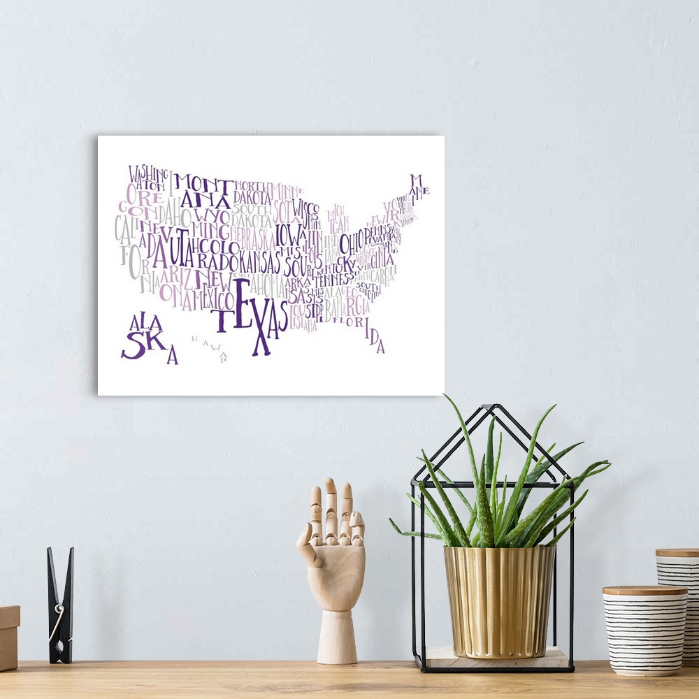 A bohemian room featuring A hand-drawn typography map of the United States with all the state names, in purple and grey.