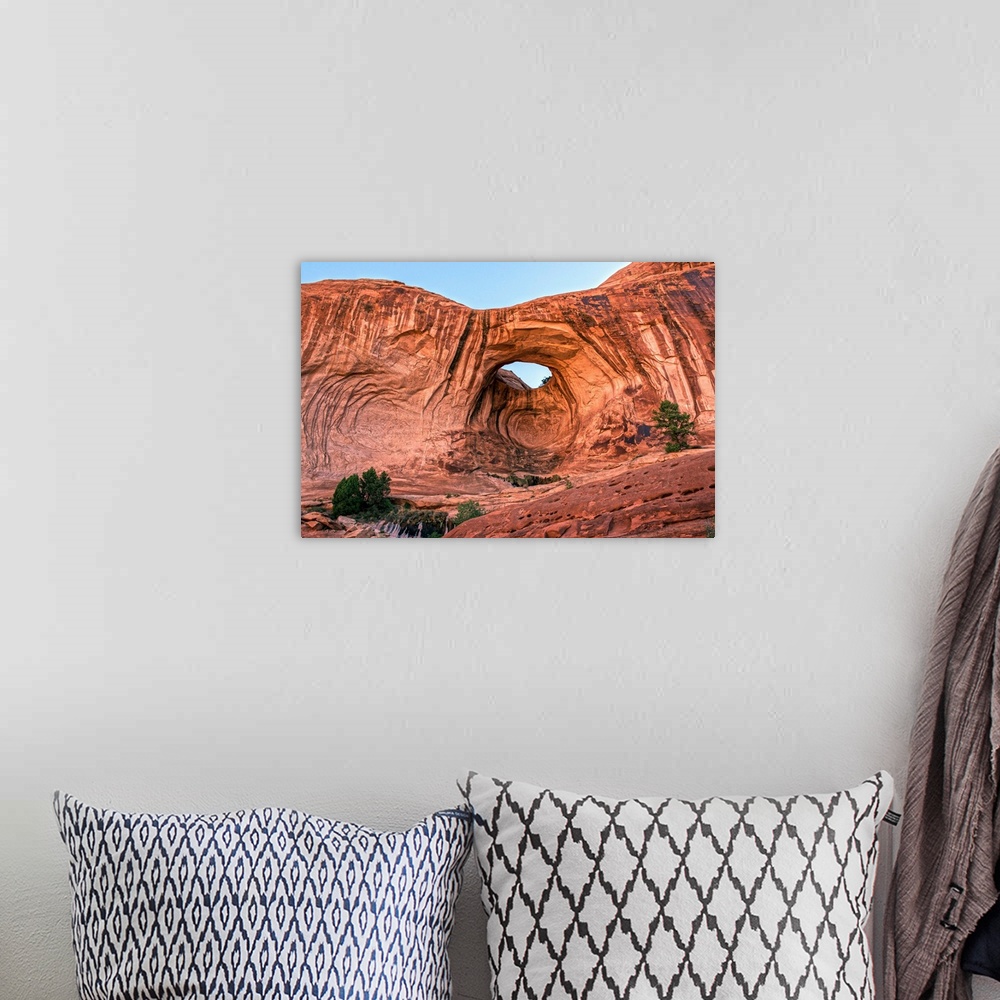 A bohemian room featuring Bright red rock contrasting with the blue sky at the Bowtie Arch, Arches National Park, Utah.