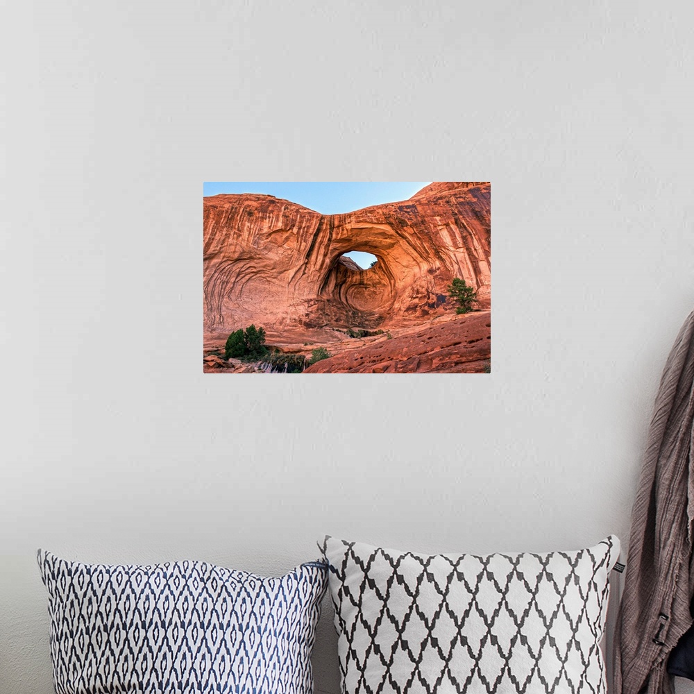 A bohemian room featuring Bright red rock contrasting with the blue sky at the Bowtie Arch, Arches National Park, Utah.