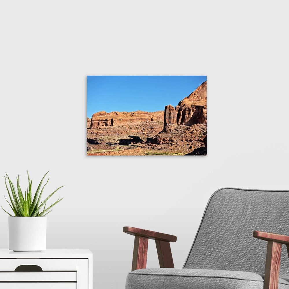 A modern room featuring Red Rock cliffs made of eroded sandstone in the desert landscape of Arches National Park, Moab, U...
