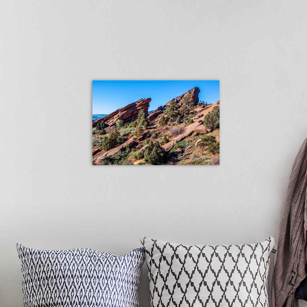 A bohemian room featuring Photo of rising rocks along Red Rocks trail in Colorado.
