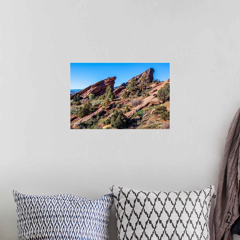 A bohemian room featuring Photo of rising rocks along Red Rocks trail in Colorado.