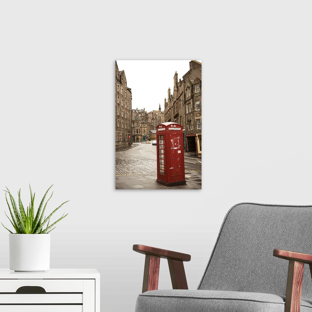 A modern room featuring Photograph of a red telephone booth on a street corner in Edinburgh, surrounded by beautiful arch...