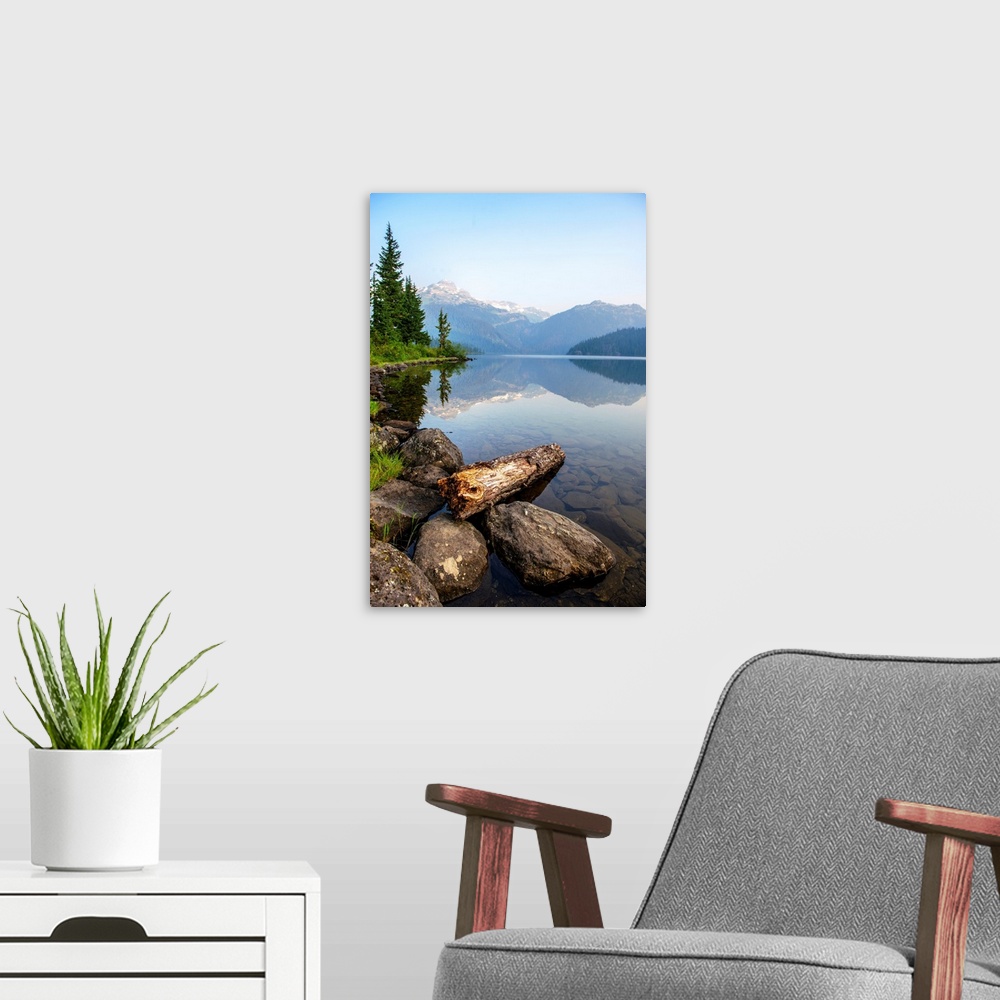 A modern room featuring Reflection on Callaghan Lake with Rocks in British Columbia, Canada.