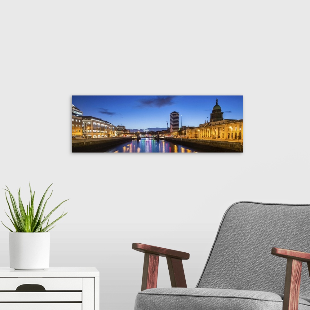 A modern room featuring Panoramic photograph going straight down the River Liffey with buildings, highlighting The Custom...