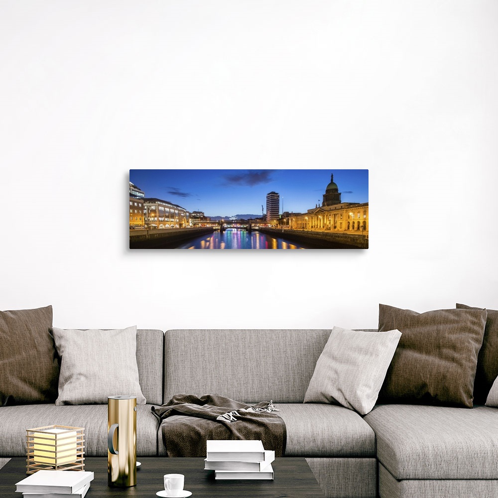 A traditional room featuring Panoramic photograph going straight down the River Liffey with buildings, highlighting The Custom...