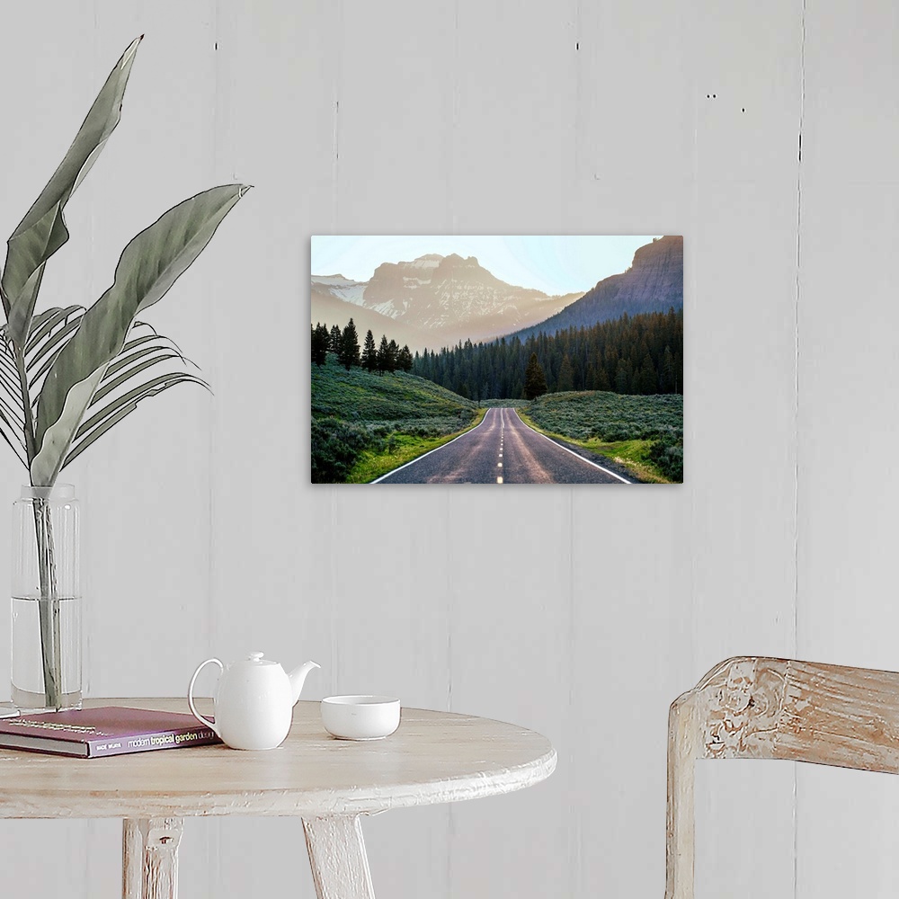 A farmhouse room featuring Horizontal image of a road heading to the mountains at Yellowstone National Park.