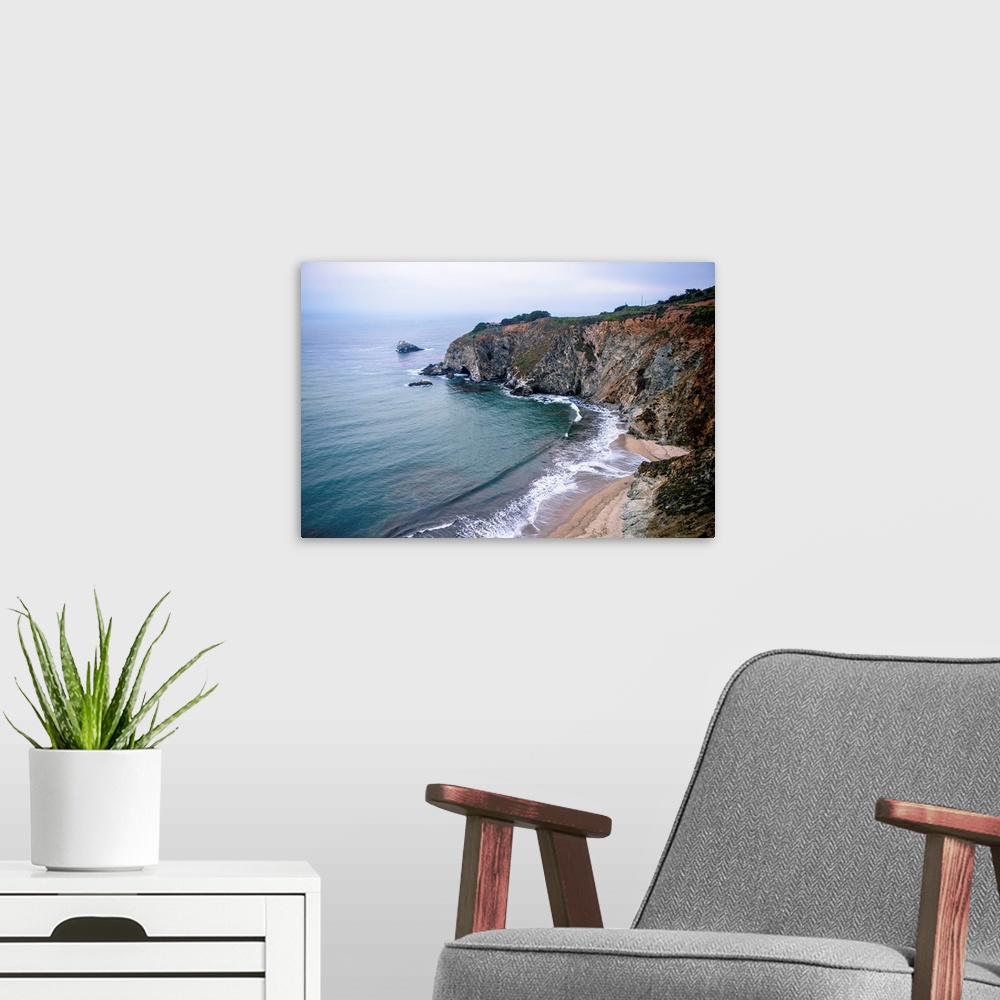 A modern room featuring View of Rocky Creek Bridge beach landscape in Monterey County, California.