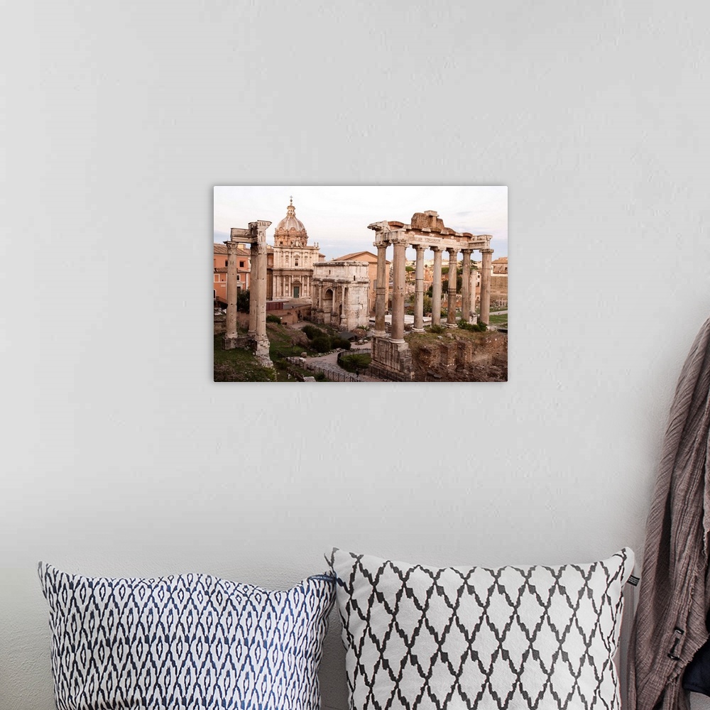 A bohemian room featuring Photograph of the ruins at the Roman Forum.