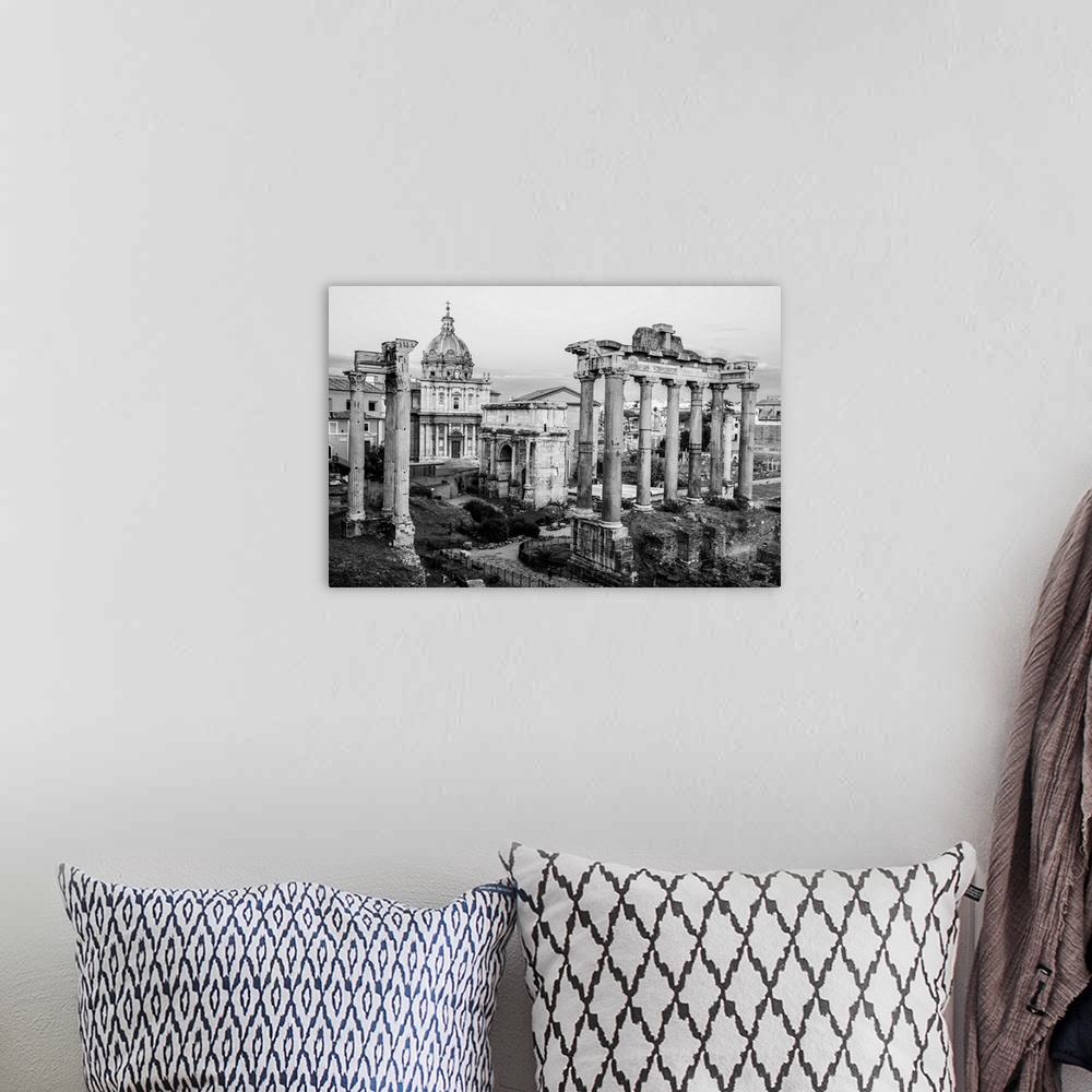 A bohemian room featuring Black and White photograph of the ruins at the Roman Forum.