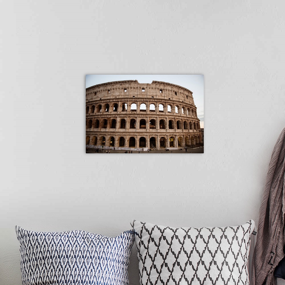 A bohemian room featuring Photograph of the Colosseum in Rome.